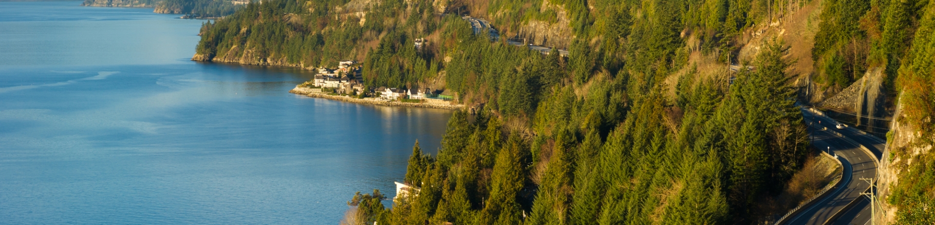 highway along side of mountains and water in Whistler