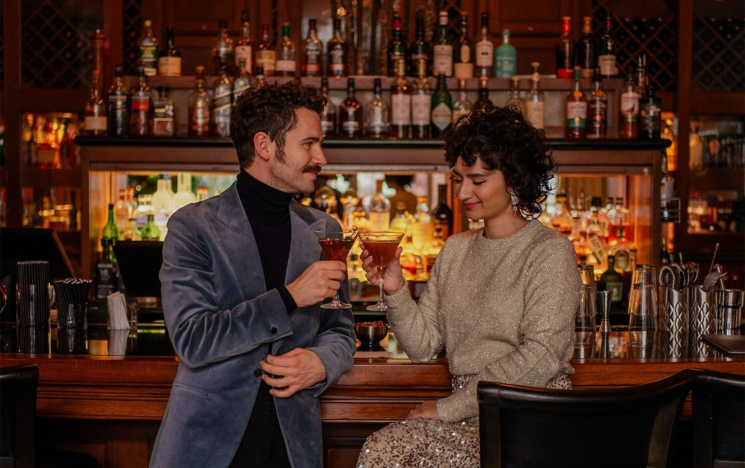 mallard lounge couple cheering in formal attire