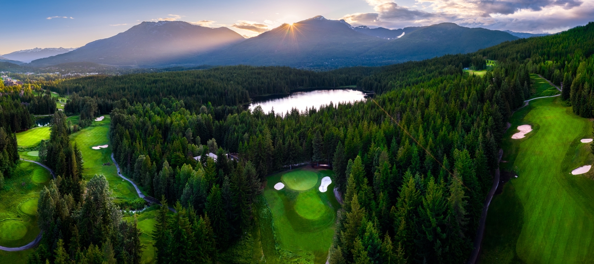 fairmont chateau whistler spring exteriors golf course aerial sunset_tal vardi