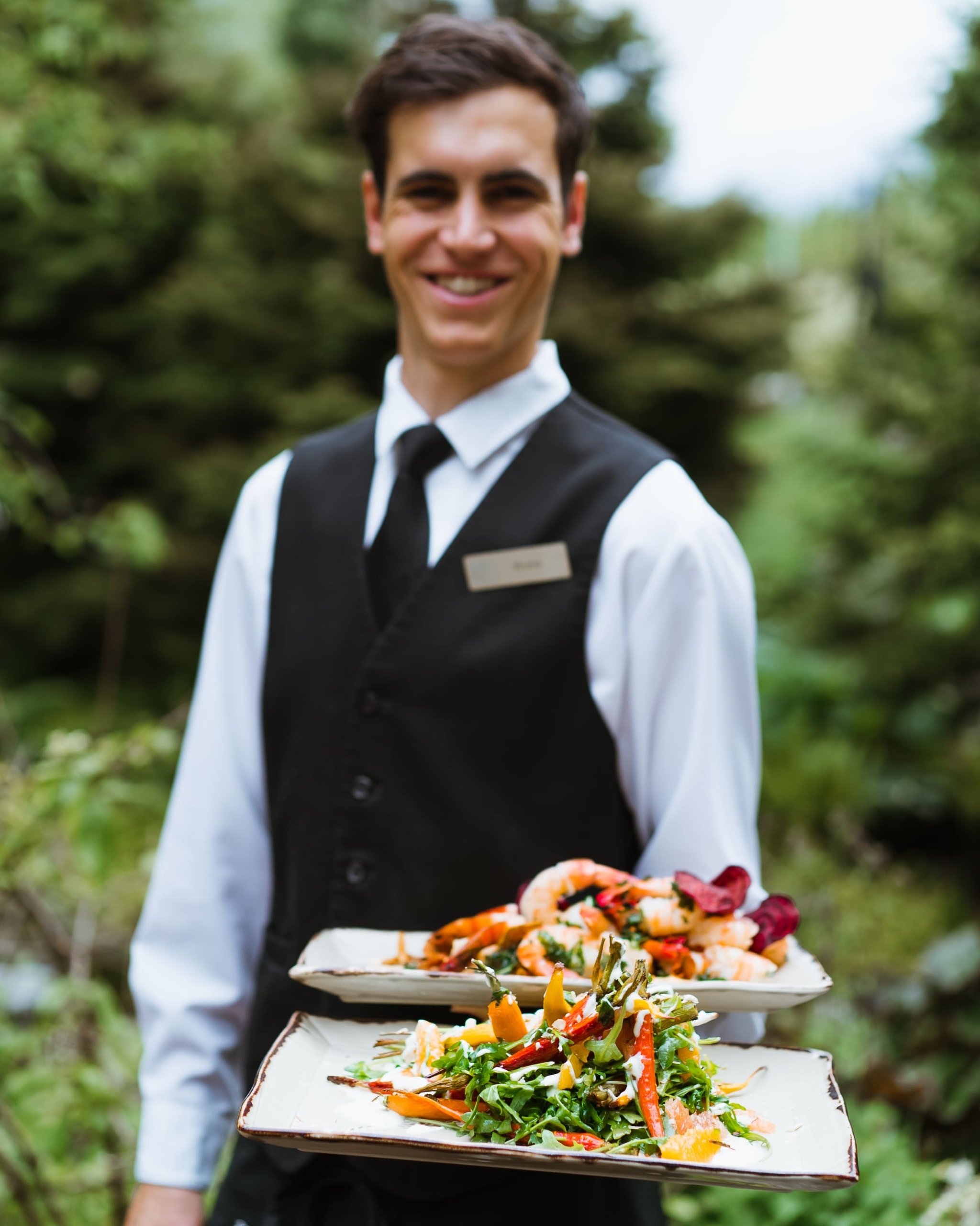 server with two plates of food