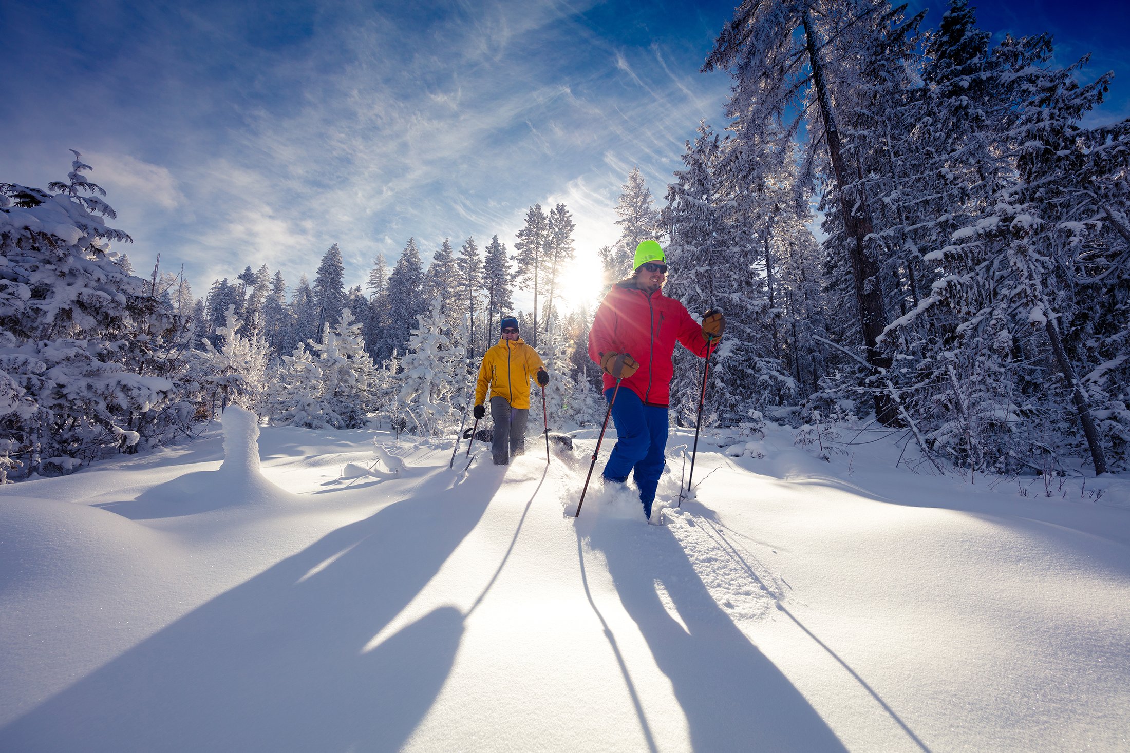 Two people snowshoeing in deep snow
