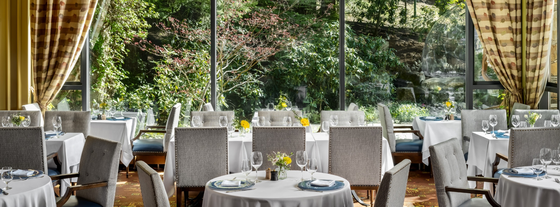 Tables and view at the Wildflower Restaurant at Fairmont Chateau Whistler