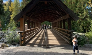 A covered wooden bridge on a scenic walk