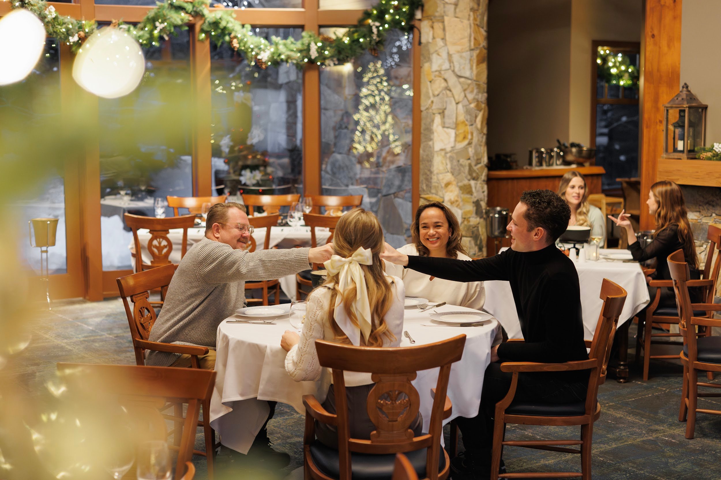 friends having fondue at the chalet fairmont chateau whistler