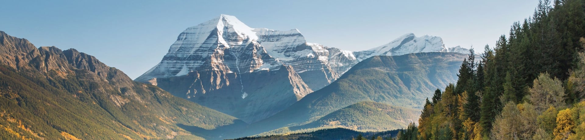 view of Mount Robson and mountainside train