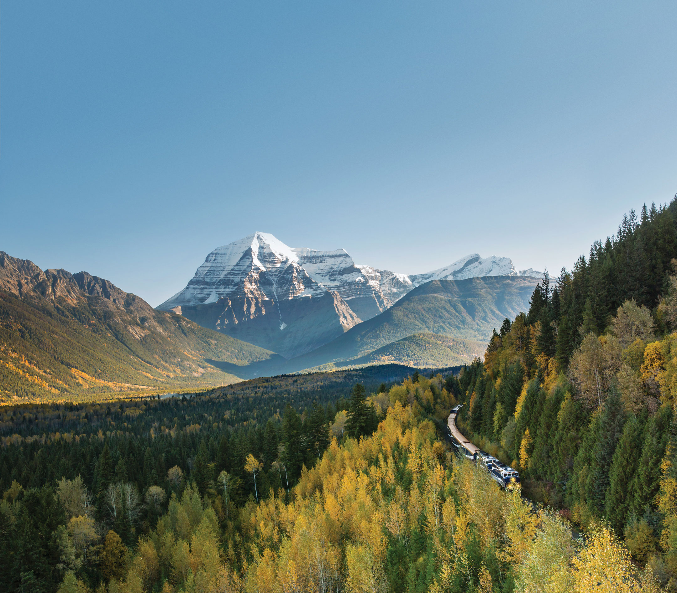 view of Mount Robson and mountainside train