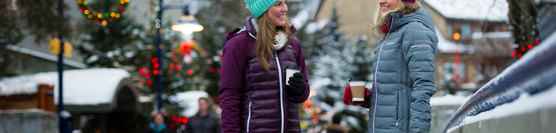 two women holding shopping bags in whistler village