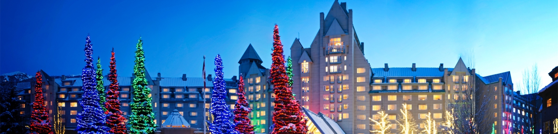 exterior shot of the resort lit up for the holidays