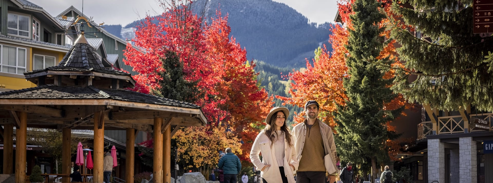 A couple shopping outdoors in Whistler during fall