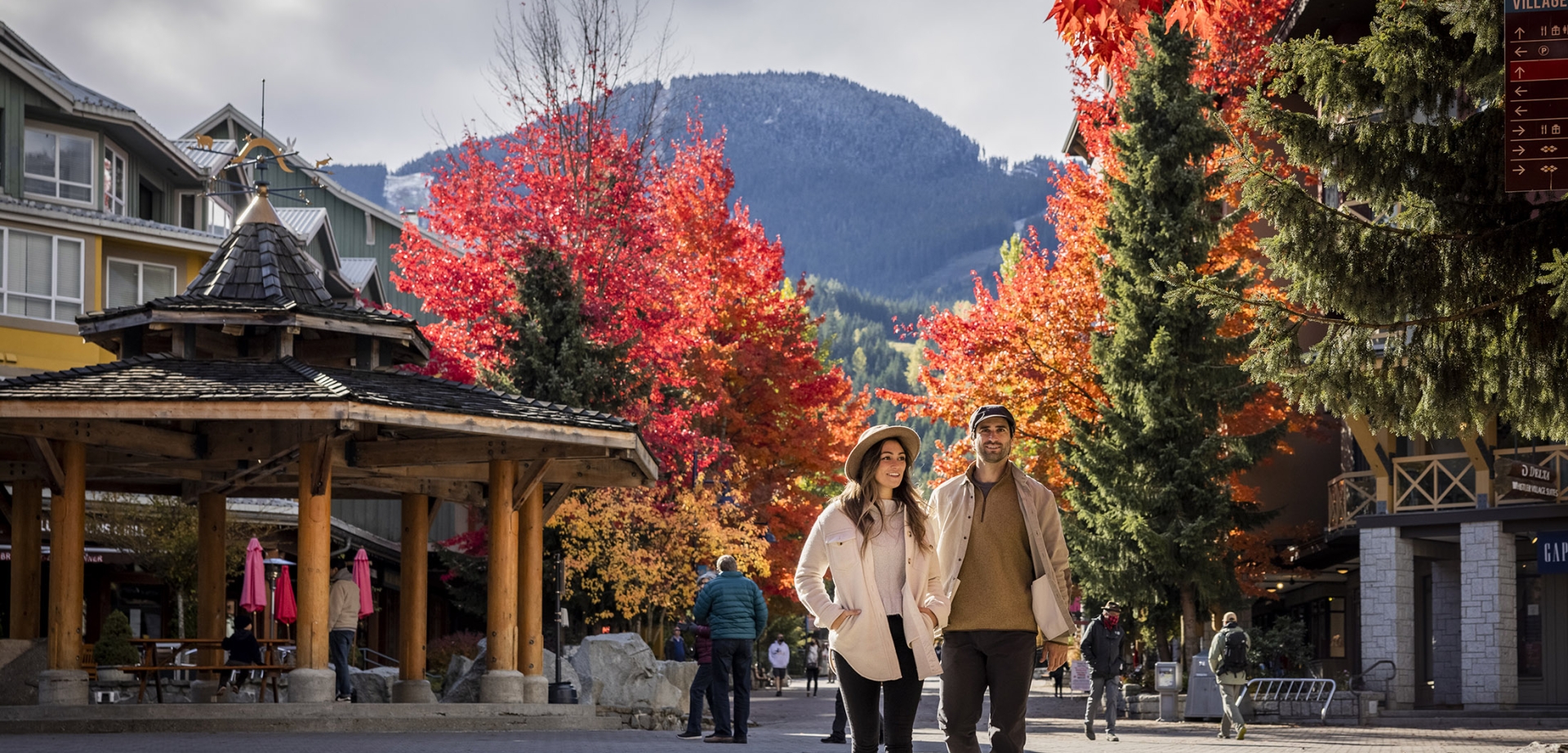 A couple shopping outdoors in Whistler during fall