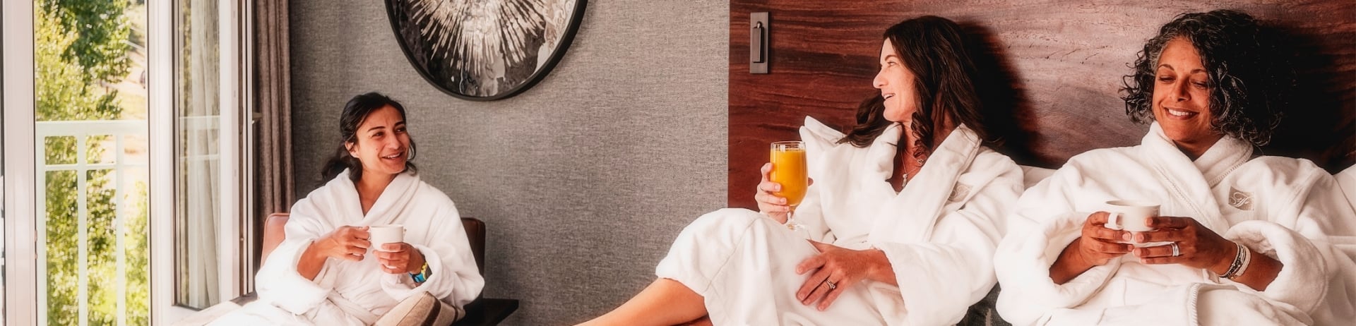 a group of ladies eating breakfast in their room
