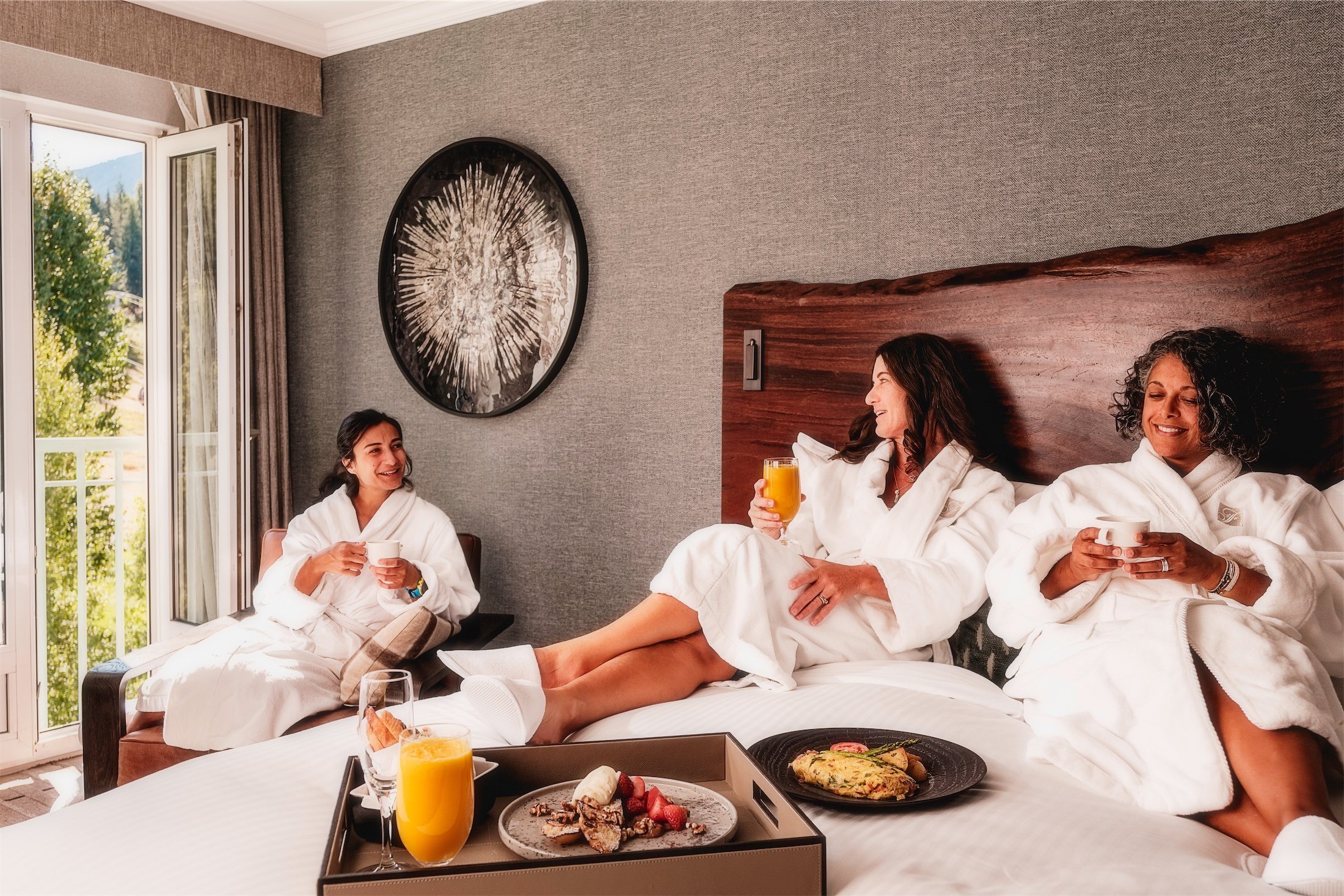 a group of ladies eating breakfast in their room