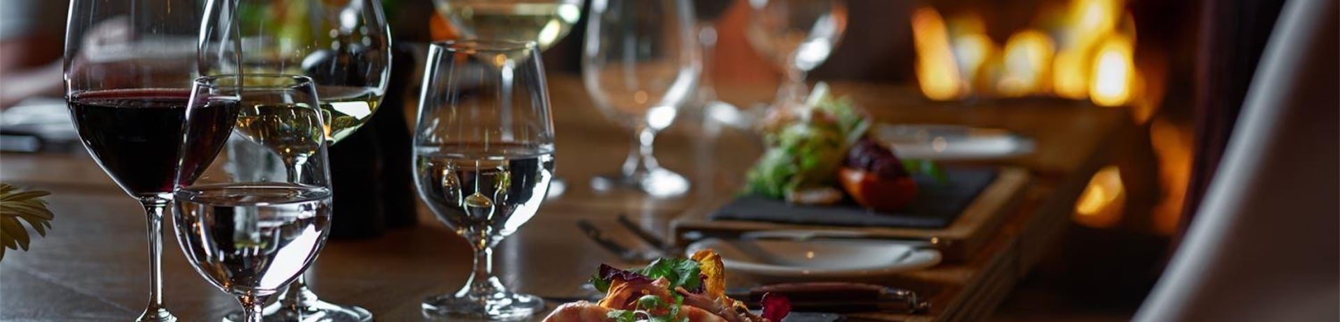 people drinking wine and eating dinner