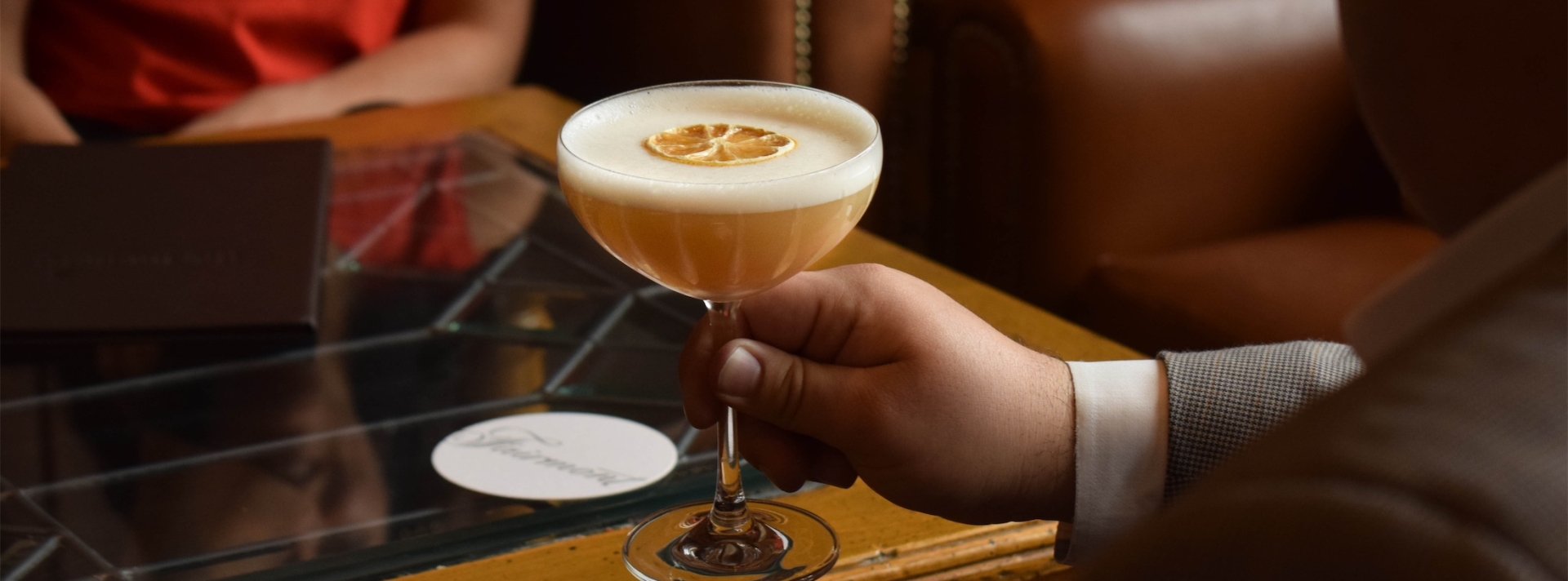 a man about to drink a cocktail