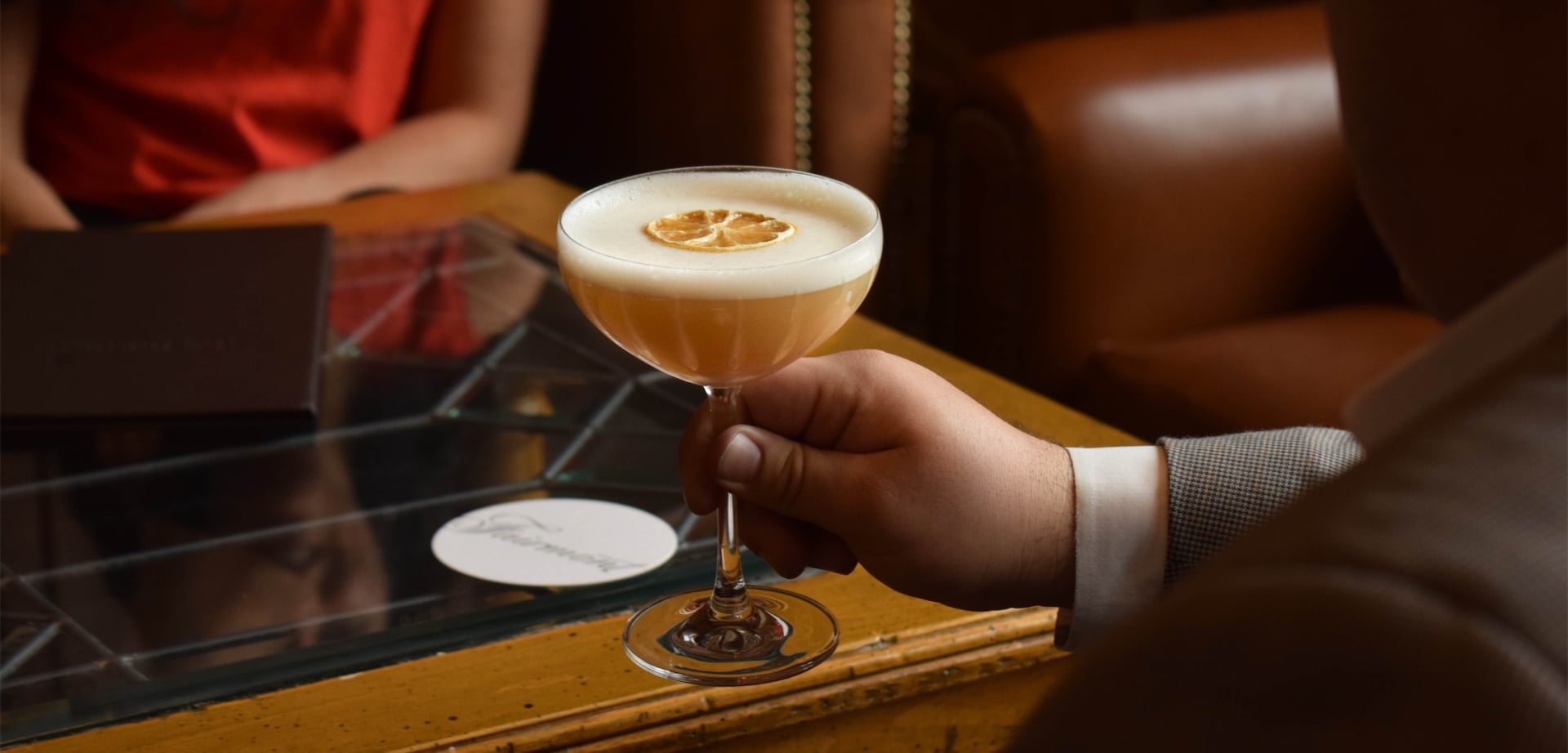 a man about to drink a cocktail