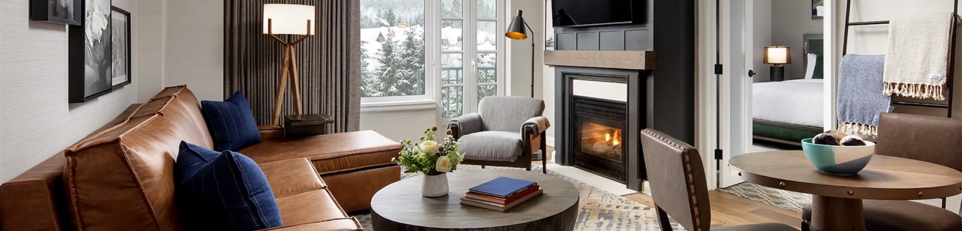 large living room with sectional and a fireplace