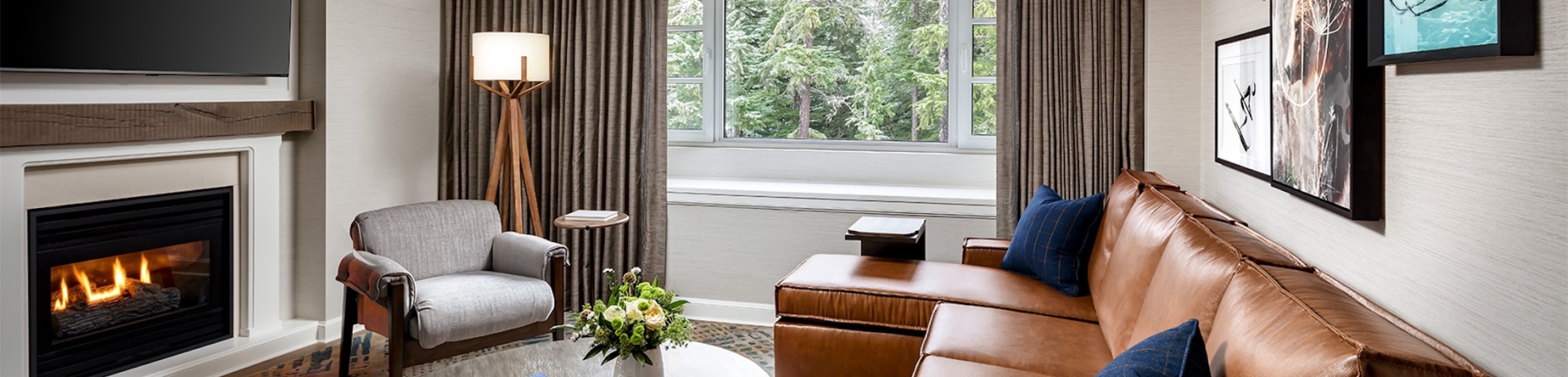 living room with sectional and a fireplace