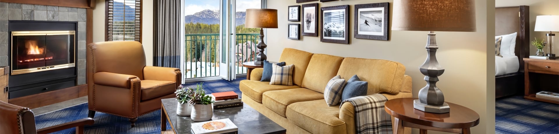 living room with sofa and two chairs with view of the bedroom