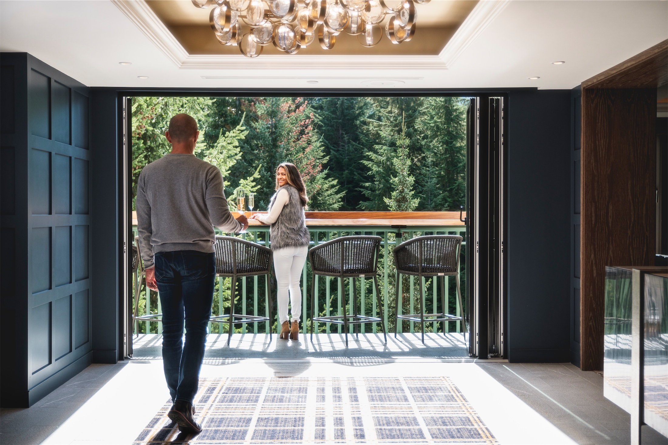 woman waiting for her partner to sit with her on the balcony