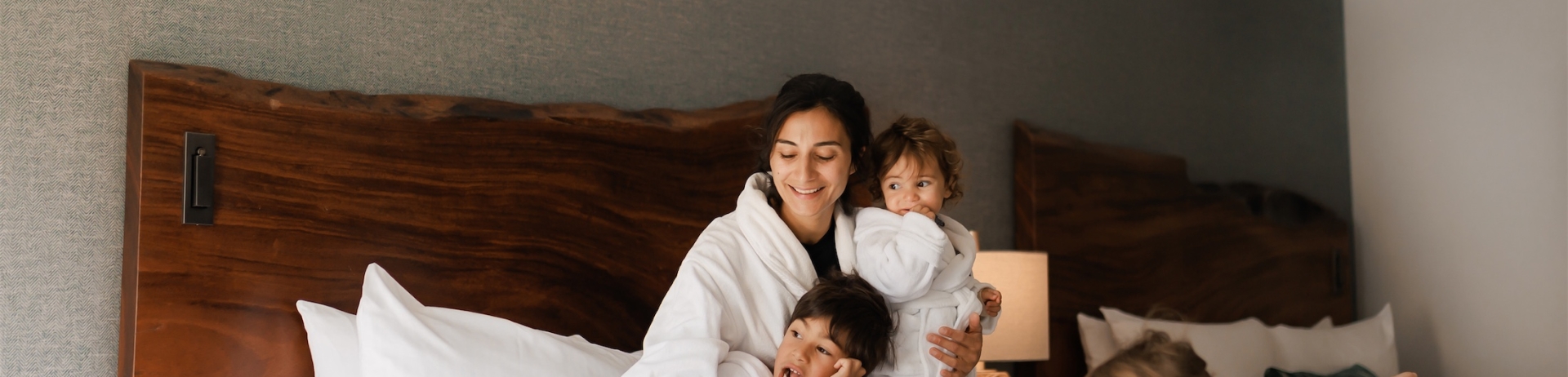 a family cuddling in a bed