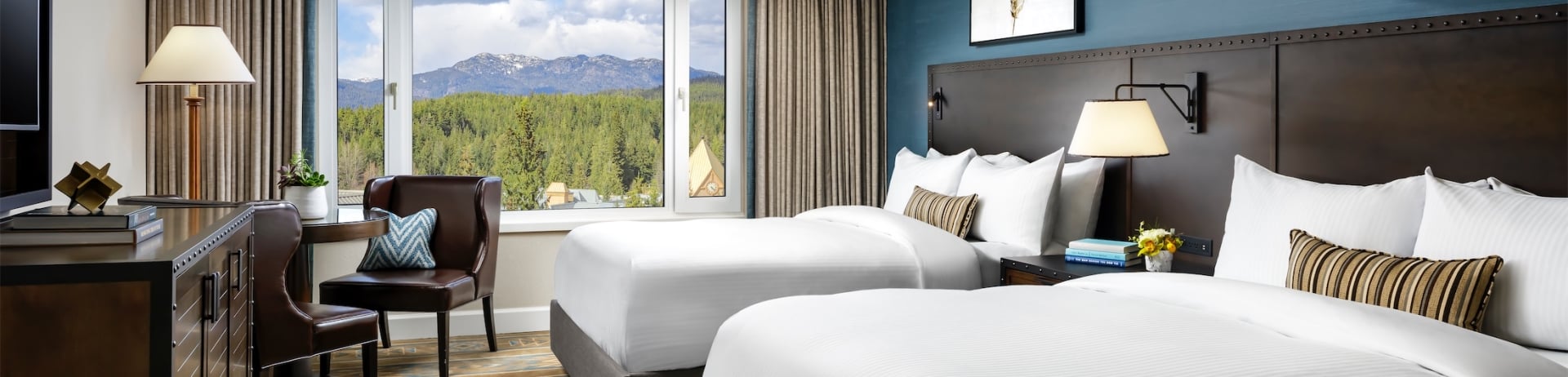 bedroom with two beds and small table