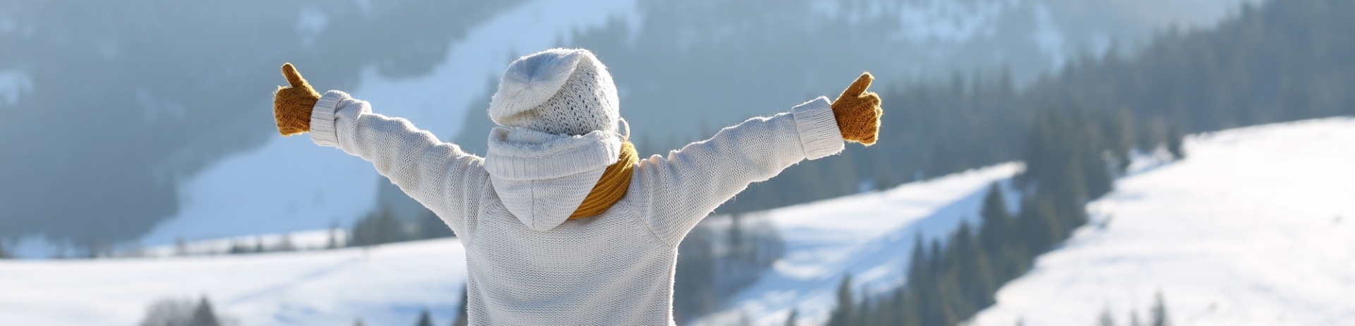 child sitting on bench with stuffed bear