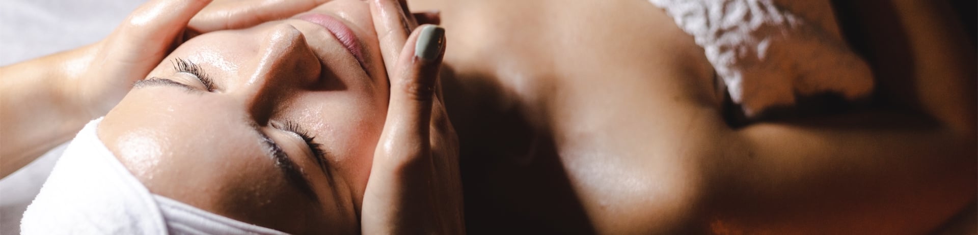Happy woman receiving a beauty treatment