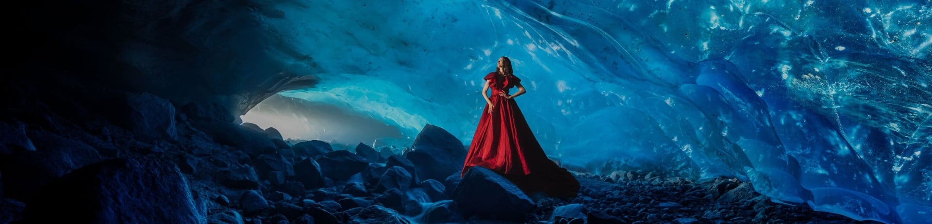 woman in red dress in ice cave