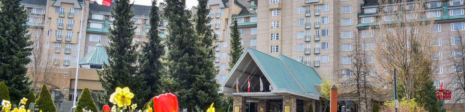 exterior of Fairmont Chateau Whistler in spring