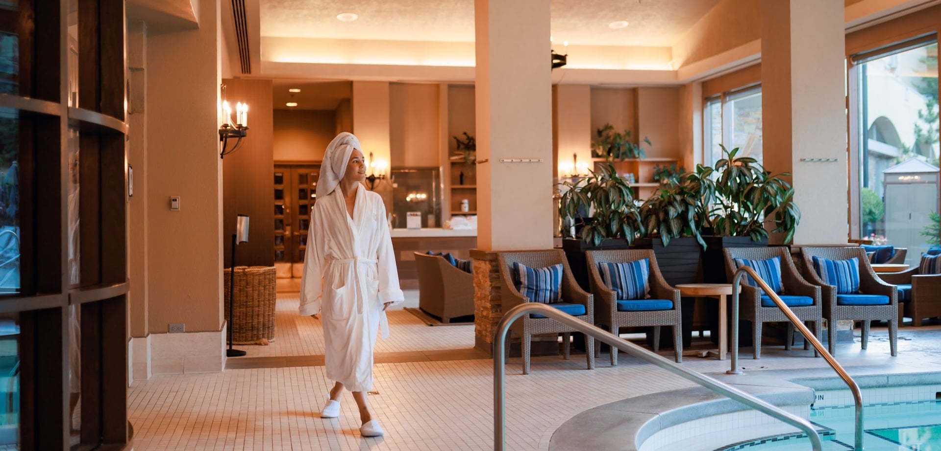 woman walking by the Fairmont Chateau Whistler health club