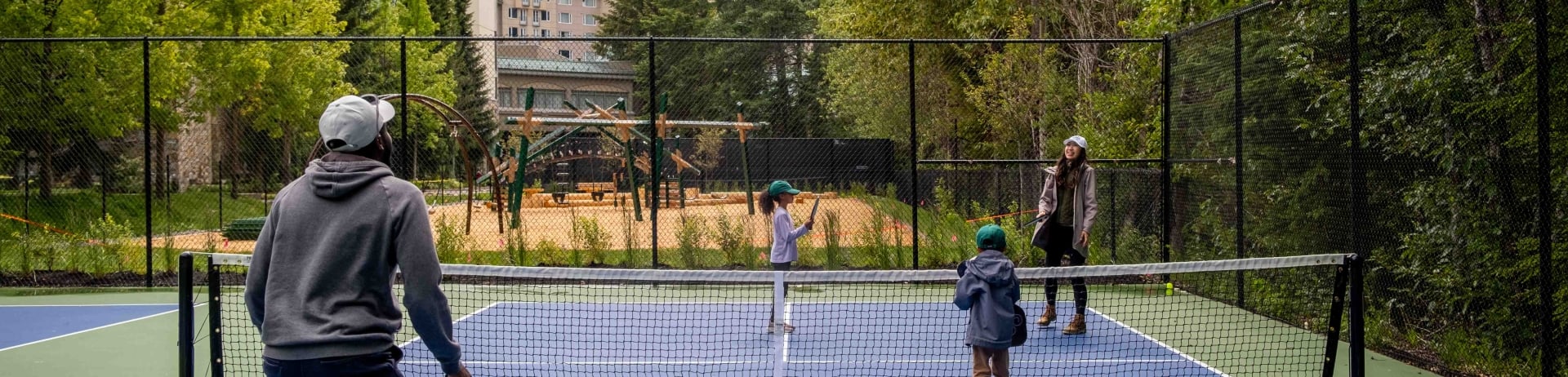 family playing pickleball at fairmont chateau whistler