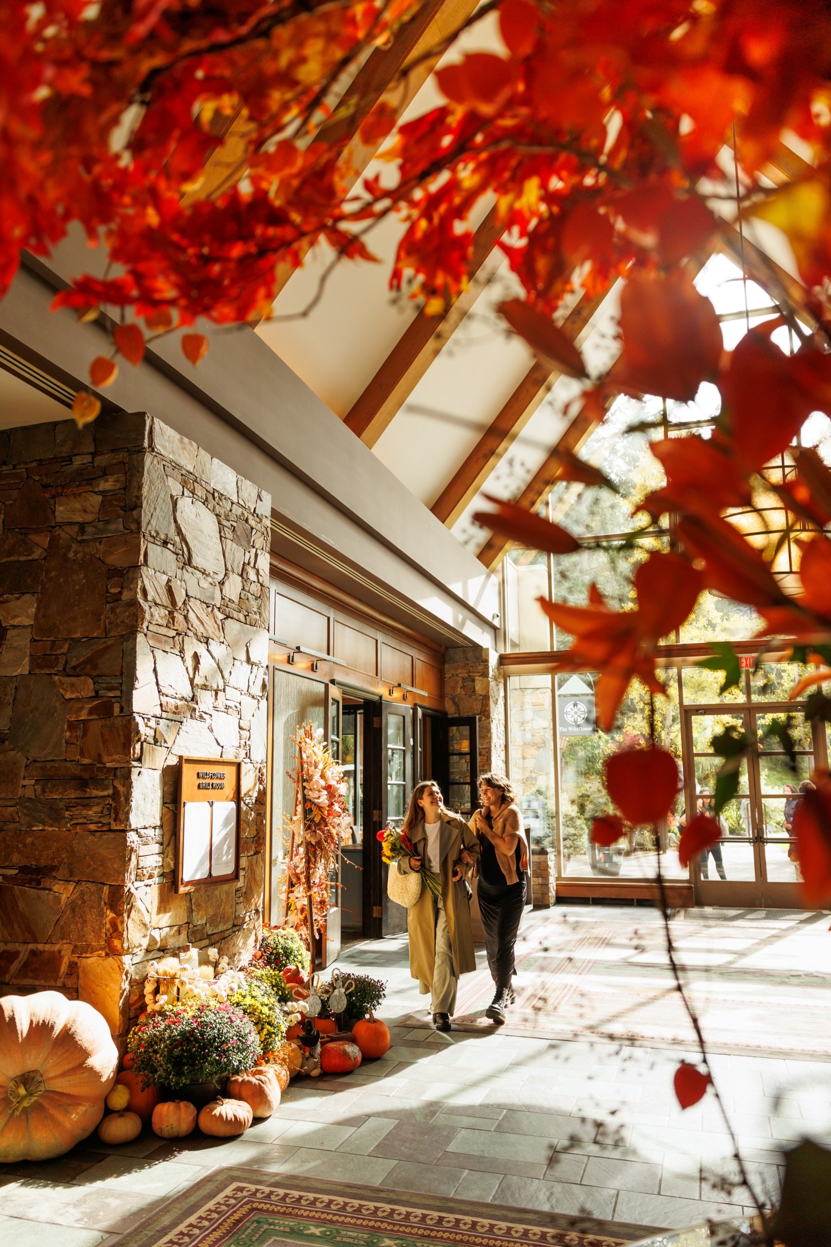 fairmont chateau whistler fall lifestyle hotel interior, two ladies walking