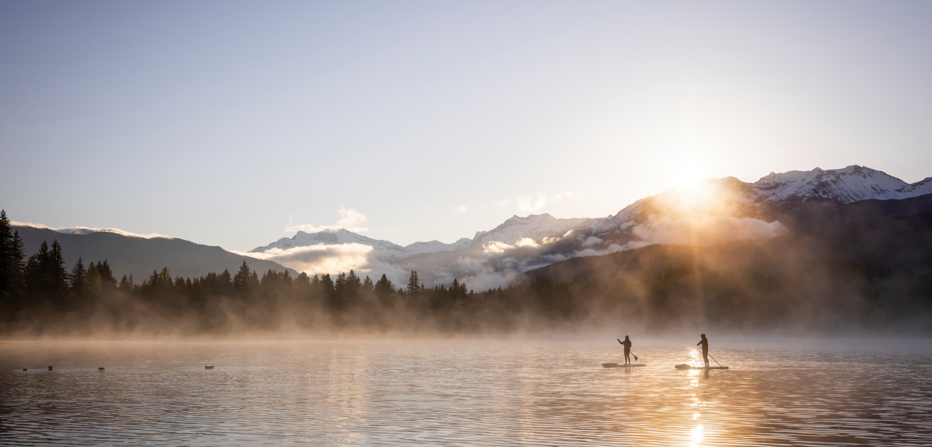 paddleboarding lake sunset whistler couple