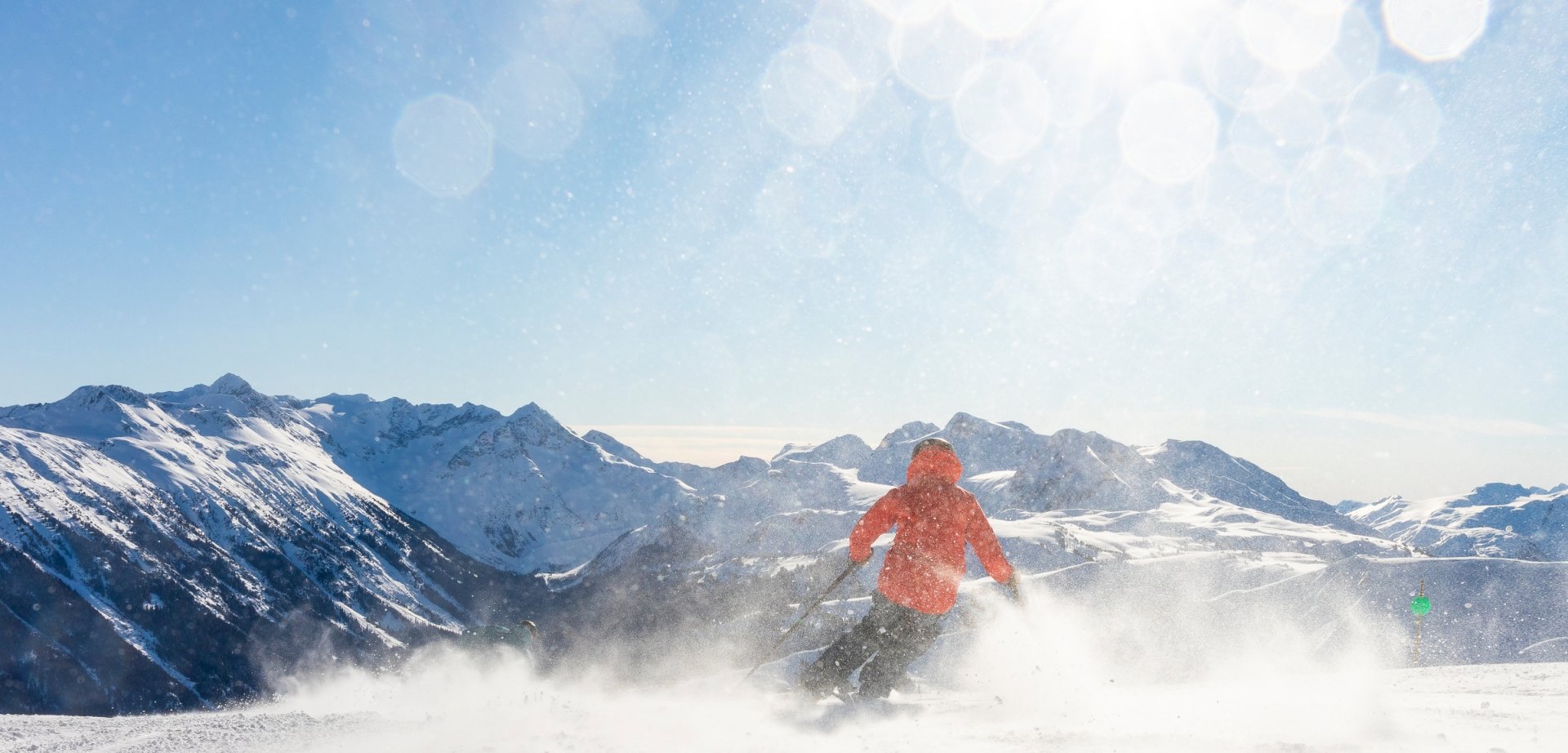 Skier on a groomer trail sunny day spring skiing whistler blackcomb