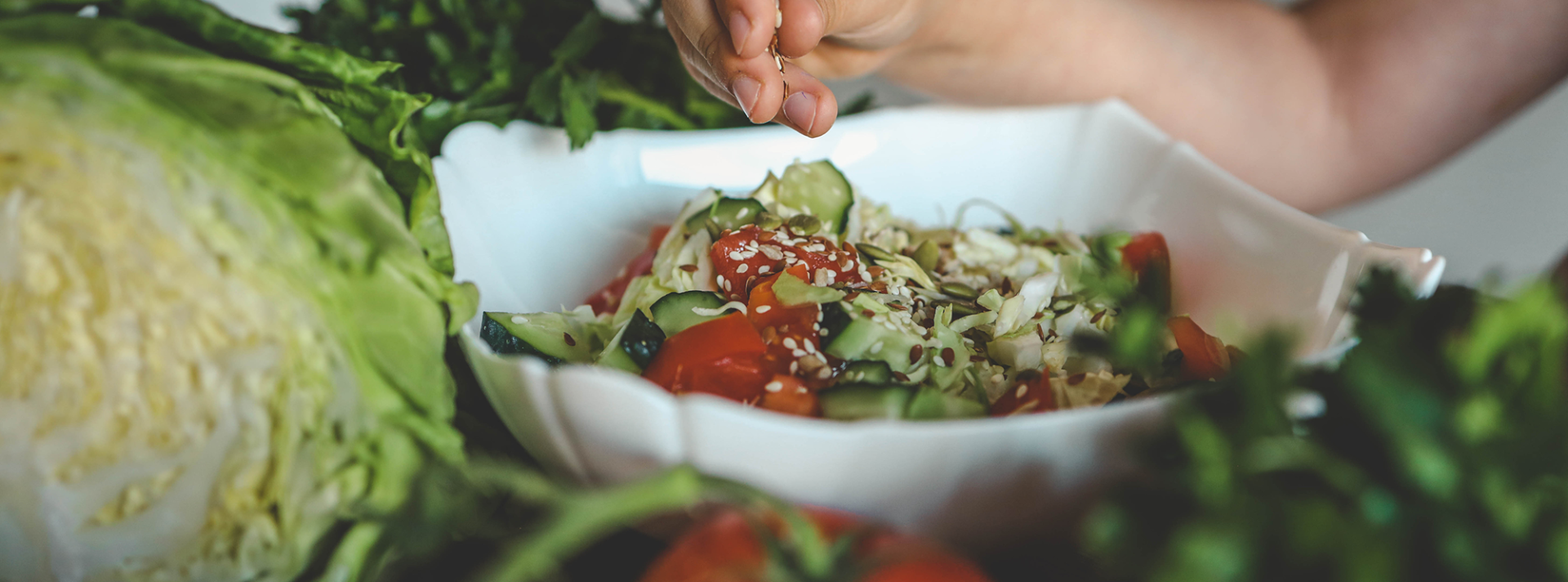 kid preparing salad bowl
