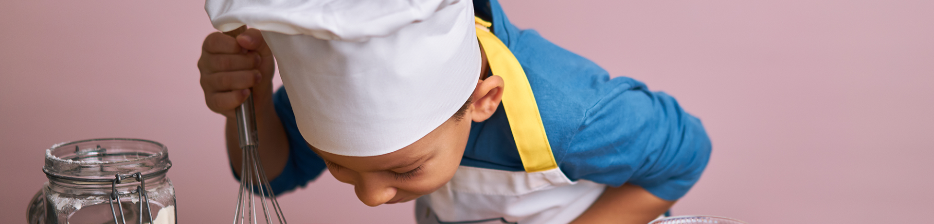 kid baking a cake at epikurious fairmont whistler cornucopia event