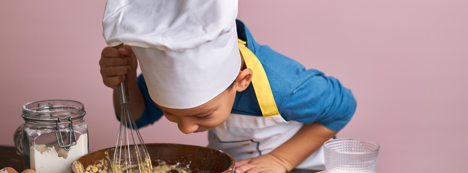 kid baking a cake at epikurious fairmont whistler cornucopia event