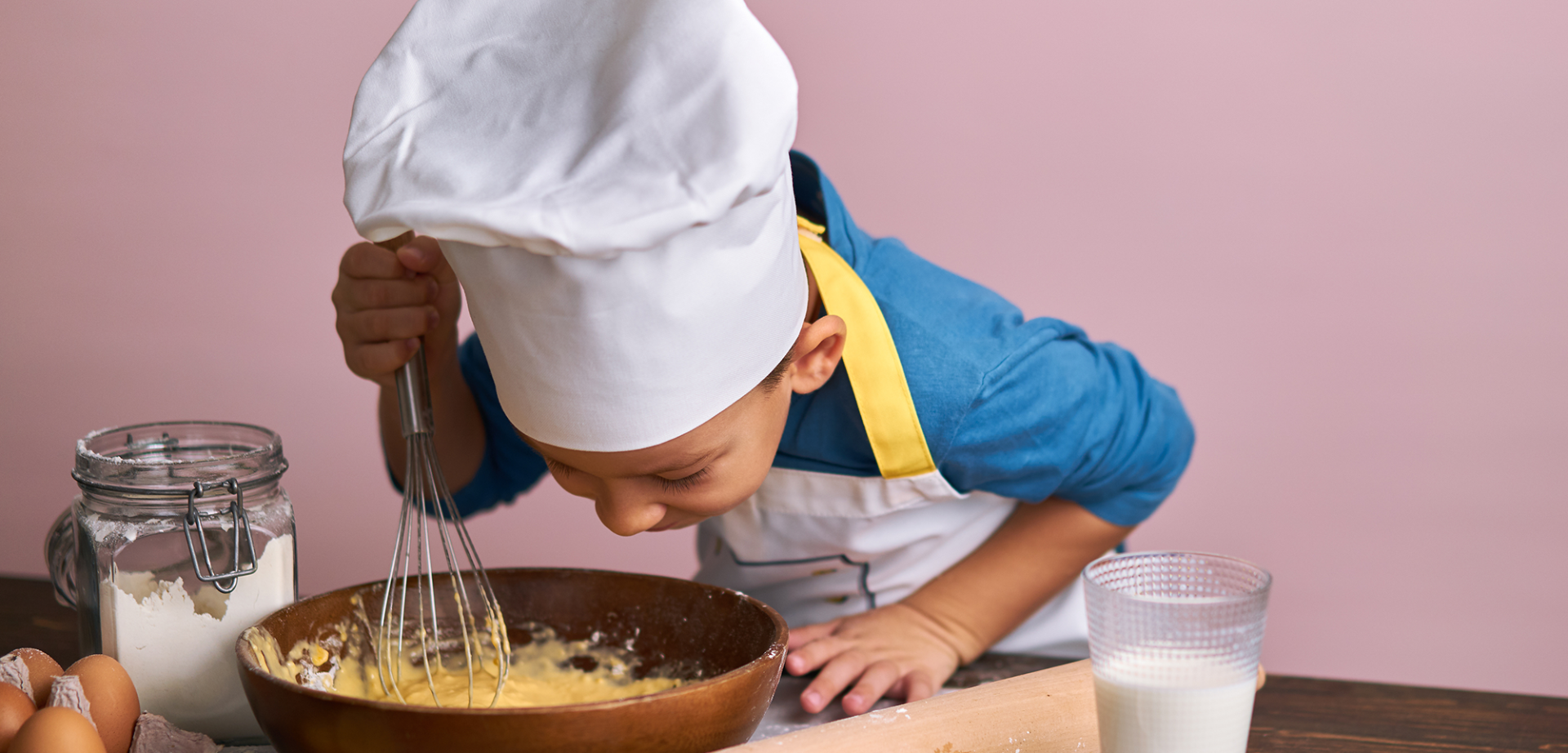 kid baking a cake at epikurious fairmont whistler cornucopia event