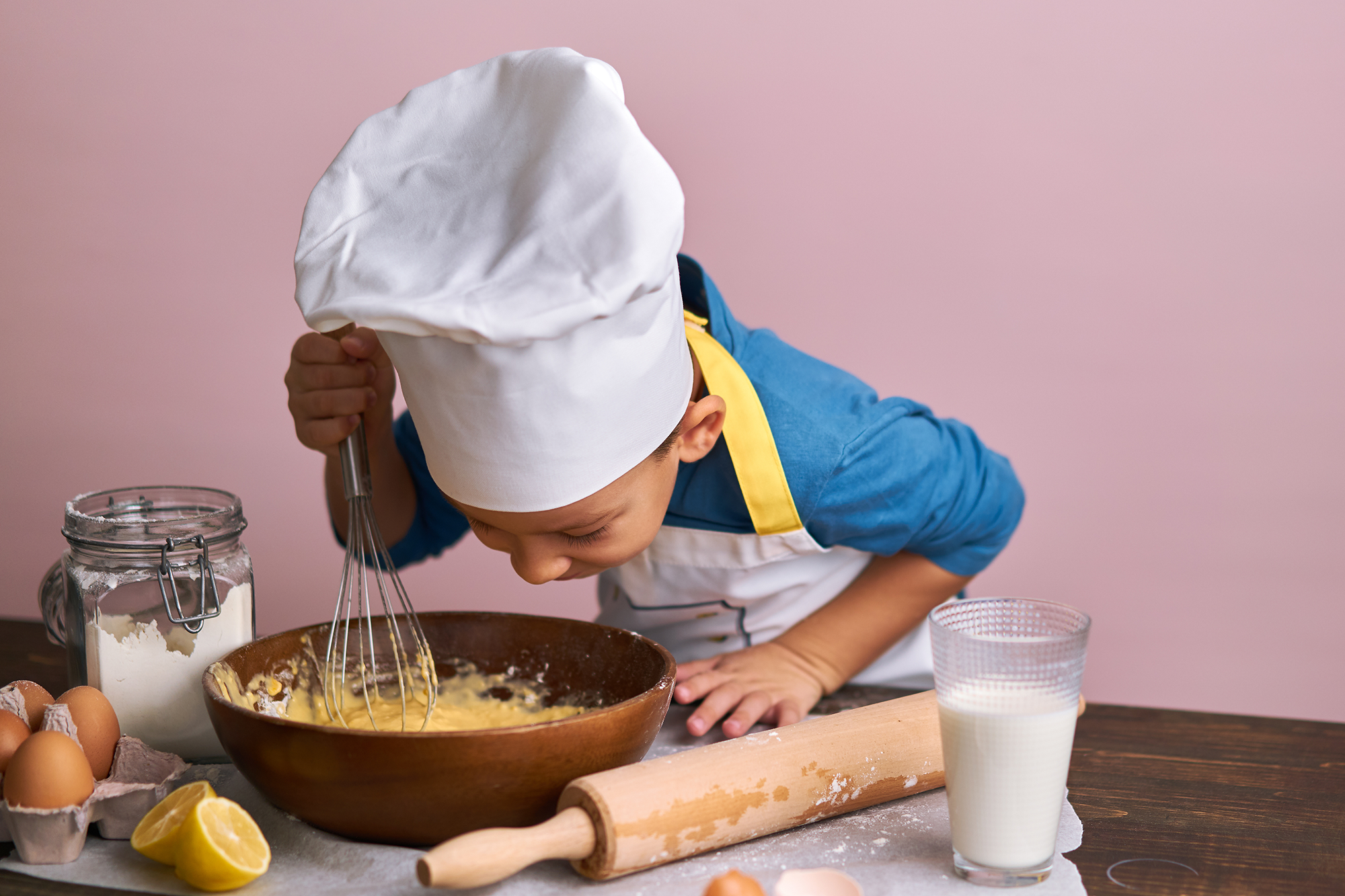 kid baking a cake at epikurious fairmont whistler cornucopia event