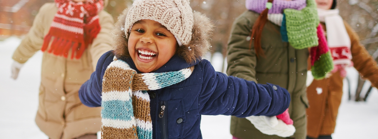 Cheerful girl and her friends spending time outdoors