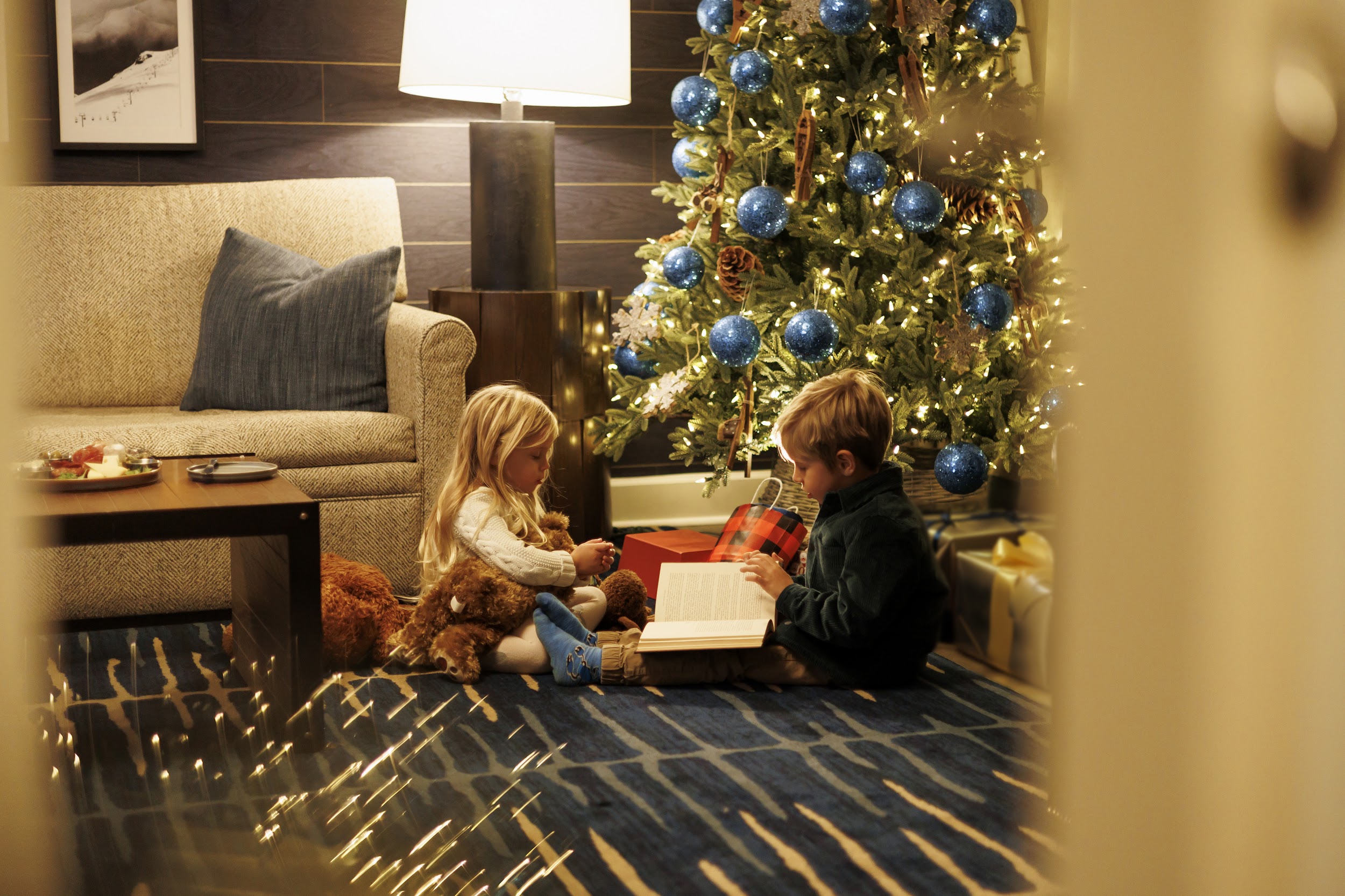 kids at fairmont chateau whistler suite with festive christmas decor
