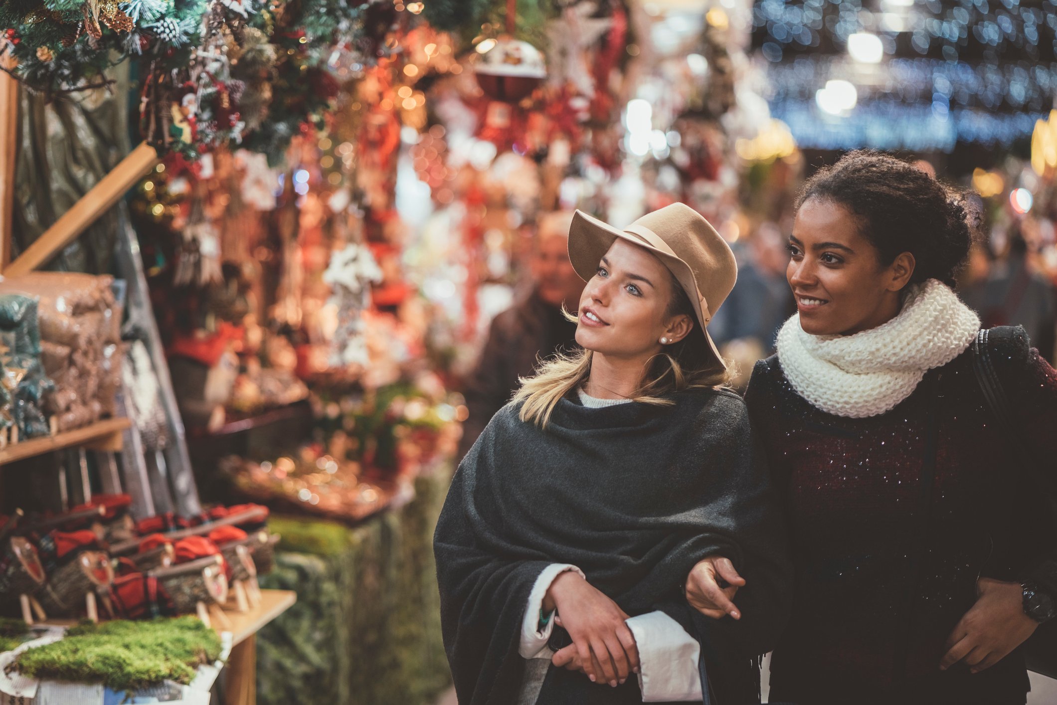 Friends shopping at Indoor festive christmas early market at fairmont chateau whistler.