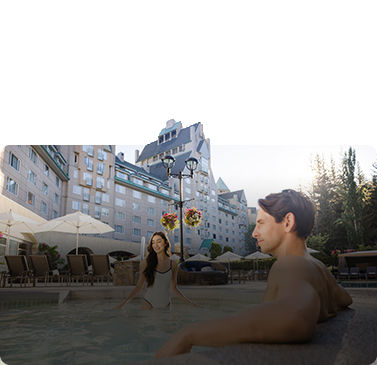 couple at the pool health club enjoying spring escape offer fairmont chateau whistler